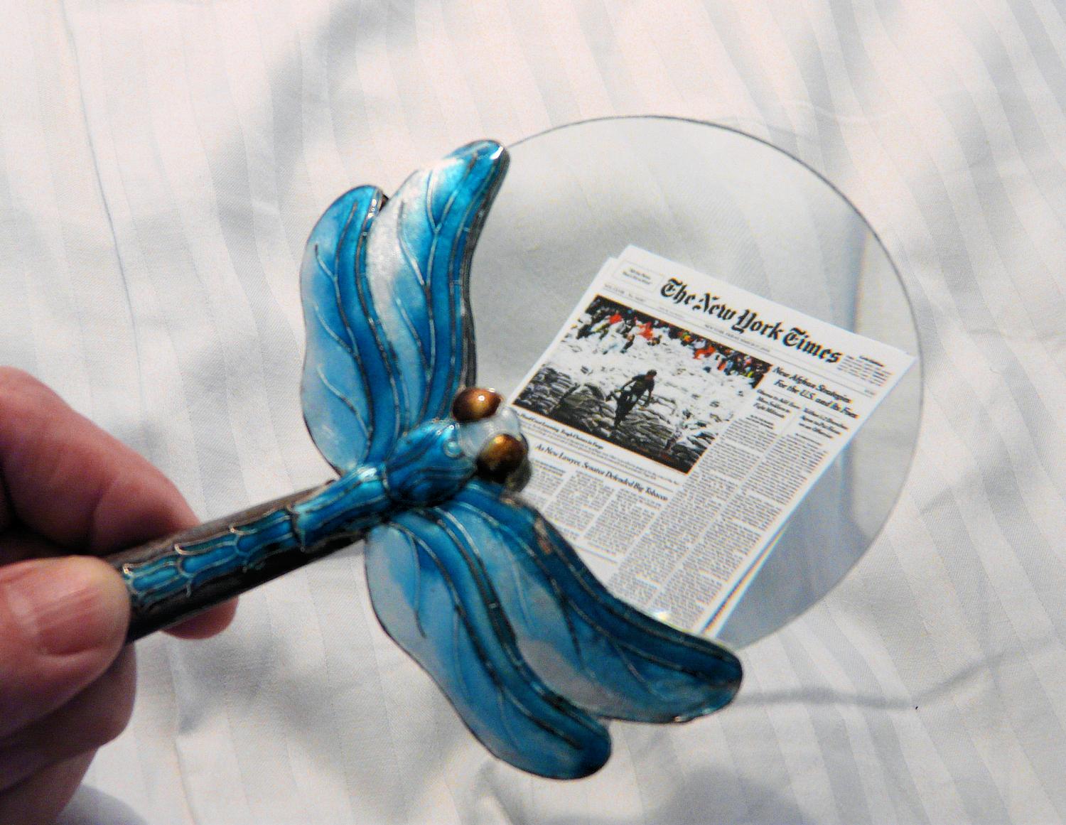 Dragonfly magnifier examining nano edition of the New York Times - Subscribers to the Nano edition will get this 'Dragonfly' magnifier. - Tony Karp, design, art, photography, techno-impressionist, techno-impressionism, aerial photography , drone , drones , dji , mavic pro , video , 3D printing - Books -